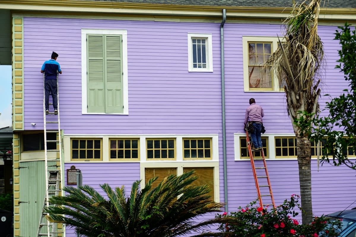 Professional painters at work on a home exterior